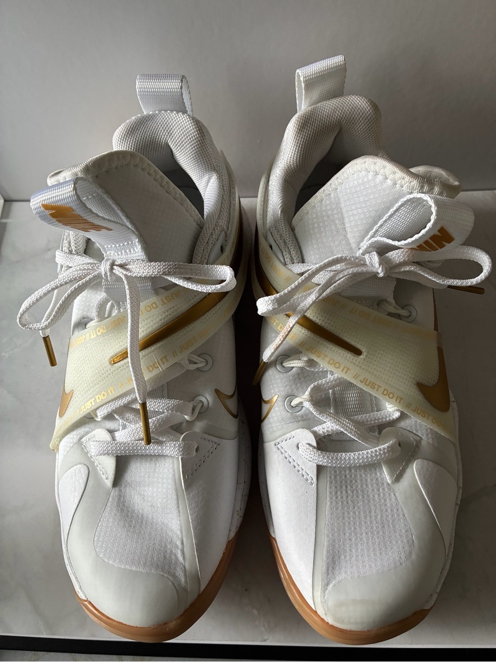 Nike Women’s White Athletic Sneakers with Gold Accents